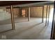 Spacious unfinished basement featuring a concrete floor, exposed beams, and access to natural light at 9107 Tenor Way, Indianapolis, IN 46231