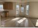 Kitchen and breakfast nook featuring tile flooring and access to the backyard at 9107 Tenor Way, Indianapolis, IN 46231