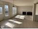 Sunlit open living room with fireplace and large windows at 9107 Tenor Way, Indianapolis, IN 46231