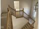 Carpeted staircase with wood banister leading to the second floor at 9107 Tenor Way, Indianapolis, IN 46231
