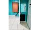A bright bathroom features a modern vanity, a mirror, and unique tile flooring at 945 N Ewing St, Indianapolis, IN 46201