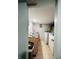 Laundry room featuring tile floors, wooden cabinets, and modern washer and dryer units at 945 N Ewing St, Indianapolis, IN 46201