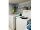 Laundry room with a washer and dryer and shelving at 945 N Ewing St, Indianapolis, IN 46201