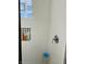 White tiled shower with black accent tile and a glass block window at 945 N Ewing St, Indianapolis, IN 46201