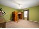 Spacious bedroom with a wood loft bed, desk, and carpet flooring, offering a versatile living space at 9698 W Lantern Ln, Pendleton, IN 46064