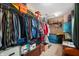 Large walk-in closet filled with clothes, boxes, and storage items, providing ample storage space at 9698 W Lantern Ln, Pendleton, IN 46064