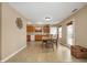 Dining area adjacent to the kitchen, featuring natural lighting and a walkout at 9698 W Lantern Ln, Pendleton, IN 46064