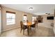 Bright dining area showcasing wood floors, and easy access to the living room and backyard at 9698 W Lantern Ln, Pendleton, IN 46064