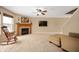 Inviting living room features neutral tones, fireplace, and plush carpeting at 9698 W Lantern Ln, Pendleton, IN 46064