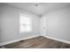 Neutral bedroom with light-filled window and modern flooring at 1130 E Bradbury Ave, Indianapolis, IN 46203
