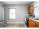 Kitchen featuring appliances and a window offering natural light at 1130 E Bradbury Ave, Indianapolis, IN 46203