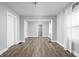 Open-concept living area features modern flooring, fresh paint, and lots of natural light at 1130 E Bradbury Ave, Indianapolis, IN 46203