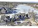 Beautiful home on a lakeside lot, surrounded by trees and other residences, providing a sense of community at 11338 Bayhill Way, Indianapolis, IN 46236