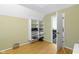 Bedroom featuring hardwood floors, natural light, and an open door to another room at 11338 Bayhill Way, Indianapolis, IN 46236