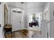 Inviting entryway with hardwood floors, a view of a home office, and a bright, open atmosphere at 11338 Bayhill Way, Indianapolis, IN 46236