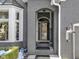 Close-up of the front entrance showcasing the door, architectural details, and landscaping, welcoming visitors at 11338 Bayhill Way, Indianapolis, IN 46236