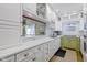 Modern kitchen with white cabinets, marble countertops, and a view to the dining area at 11338 Bayhill Way, Indianapolis, IN 46236