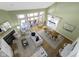 Open-concept living room with ample natural light, a fireplace, and hardwood floors at 11338 Bayhill Way, Indianapolis, IN 46236