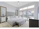 Sunlit main bedroom featuring a large window and plush upholstered bed at 11338 Bayhill Way, Indianapolis, IN 46236