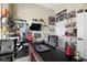 Spacious home office with a large desk, display shelving and comfortable leather chair at 11338 Bayhill Way, Indianapolis, IN 46236
