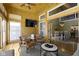 Charming sunroom with wood walls, television, and an open doorway to the dining area at 11338 Bayhill Way, Indianapolis, IN 46236