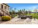 Enjoy the expansive backyard featuring a stone patio, fire pit, and stairs to elevated screened porch at 11573 Bent Tree Ct, Zionsville, IN 46077