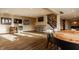 Finished basement featuring a games area with sports memorabilia, TV and drink cooler as well as a game table at 11573 Bent Tree Ct, Zionsville, IN 46077