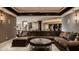 Basement living area featuring a sectional couch, dark trim, and an open floor plan at 11573 Bent Tree Ct, Zionsville, IN 46077