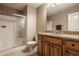 Bathroom featuring granite countertops, a glass-enclosed shower, and ample vanity cabinet at 11573 Bent Tree Ct, Zionsville, IN 46077