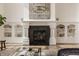 Close up of the living room fireplace with built in shelving at 11573 Bent Tree Ct, Zionsville, IN 46077