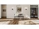 Bright foyer featuring hardwood floors, statement lighting and elegant wall decor at 11573 Bent Tree Ct, Zionsville, IN 46077