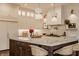 Bright kitchen with an island, pendant lights, and white custom cabinets at 11573 Bent Tree Ct, Zionsville, IN 46077