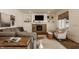 Cozy living room featuring a stone fireplace, built-in shelves, and comfortable seating at 11573 Bent Tree Ct, Zionsville, IN 46077