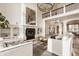 Spacious living room with fireplace, a grand staircase, and stylish furnishings at 11573 Bent Tree Ct, Zionsville, IN 46077