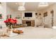 Open-concept living room and kitchen with large island, fireplace, and comfortable seating at 11573 Bent Tree Ct, Zionsville, IN 46077