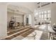 Open living space featuring hardwood floors, statement lighting and lots of natural light at 11573 Bent Tree Ct, Zionsville, IN 46077