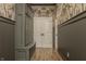 Mud room featuring a built-in storage cabinet and decorative wallpaper at 11573 Bent Tree Ct, Zionsville, IN 46077
