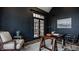 Office featuring a trestle desk, built-in shelving and cabinets, and lots of natural light at 11573 Bent Tree Ct, Zionsville, IN 46077