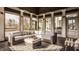 Spacious sunroom featuring comfortable seating, and views of the landscape at 11573 Bent Tree Ct, Zionsville, IN 46077