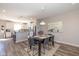 Open dining area next to the kitchen with modern lighting, a stylish table, and contemporary decor at 1208 Chapman Dr, Westfield, IN 46074