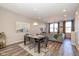 Cozy dining room featuring a modern light fixture, elegant decor, and seamless access to the living area at 1208 Chapman Dr, Westfield, IN 46074