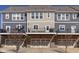 Modern townhome exterior with private balconies, attached garages, and a well-maintained facade at 1208 Chapman Dr, Westfield, IN 46074