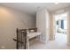 Hallway with a desk and decor leading to a naturally lit living space at 1208 Chapman Dr, Westfield, IN 46074