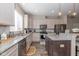 Well-lit kitchen features granite countertops, stainless steel appliances, and subway tile backsplash at 1208 Chapman Dr, Westfield, IN 46074