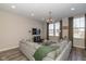 Bright living room with a large sofa, decorative accents, and abundant natural light from a window at 1208 Chapman Dr, Westfield, IN 46074