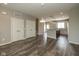 A spacious open-concept living room with hardwood floors, double closets, and views into the kitchen at 1208 Chapman Dr, Westfield, IN 46074