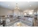 Spacious living room with a comfortable sectional sofa, stylish decor, and hardwood floors at 1208 Chapman Dr, Westfield, IN 46074