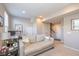 Cozy living room with neutral tones, comfortable seating, and a well-lit workspace, creating an inviting atmosphere at 1208 Chapman Dr, Westfield, IN 46074