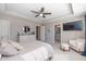 Spacious main bedroom with a ceiling fan, sitting area, dresser, and bright, neutral decor at 1208 Chapman Dr, Westfield, IN 46074
