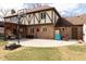 Exterior shot of a well-maintained backyard with patio, basketball hoop, and charming architecture at 12107 Castle Row Overlook, Carmel, IN 46033